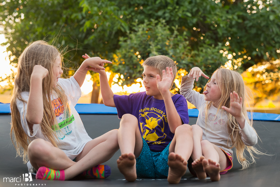 kids on trampoline - children's photography