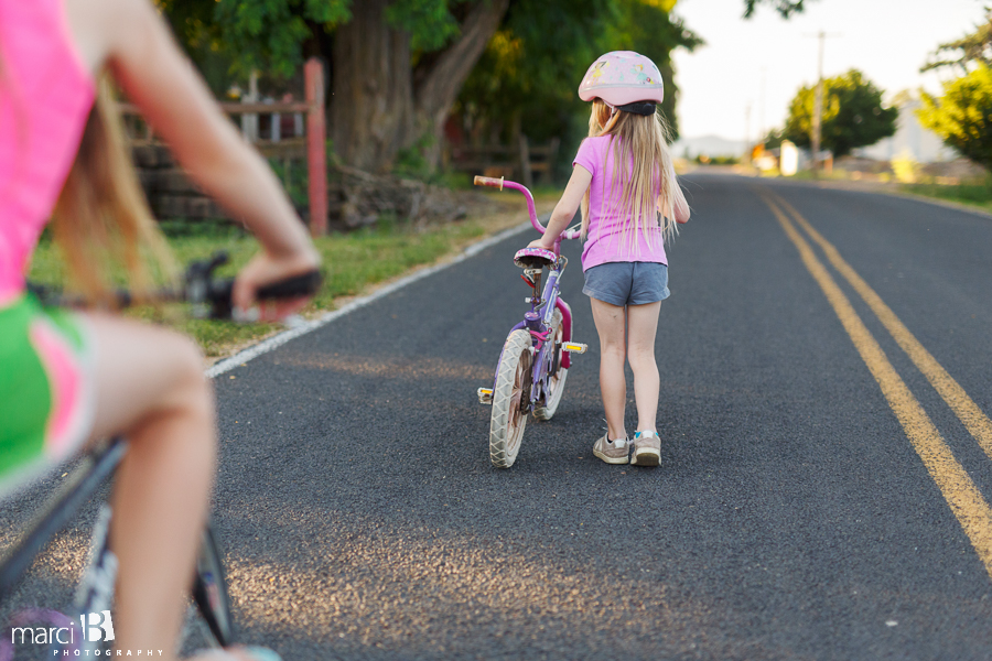 Children's photographer - sisters - biking