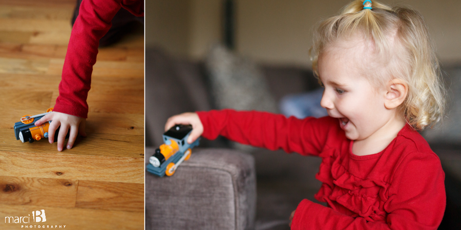 toddler playing with trains