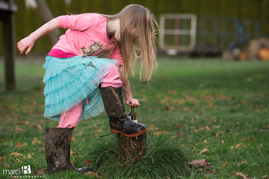 playing in mud - girl outside