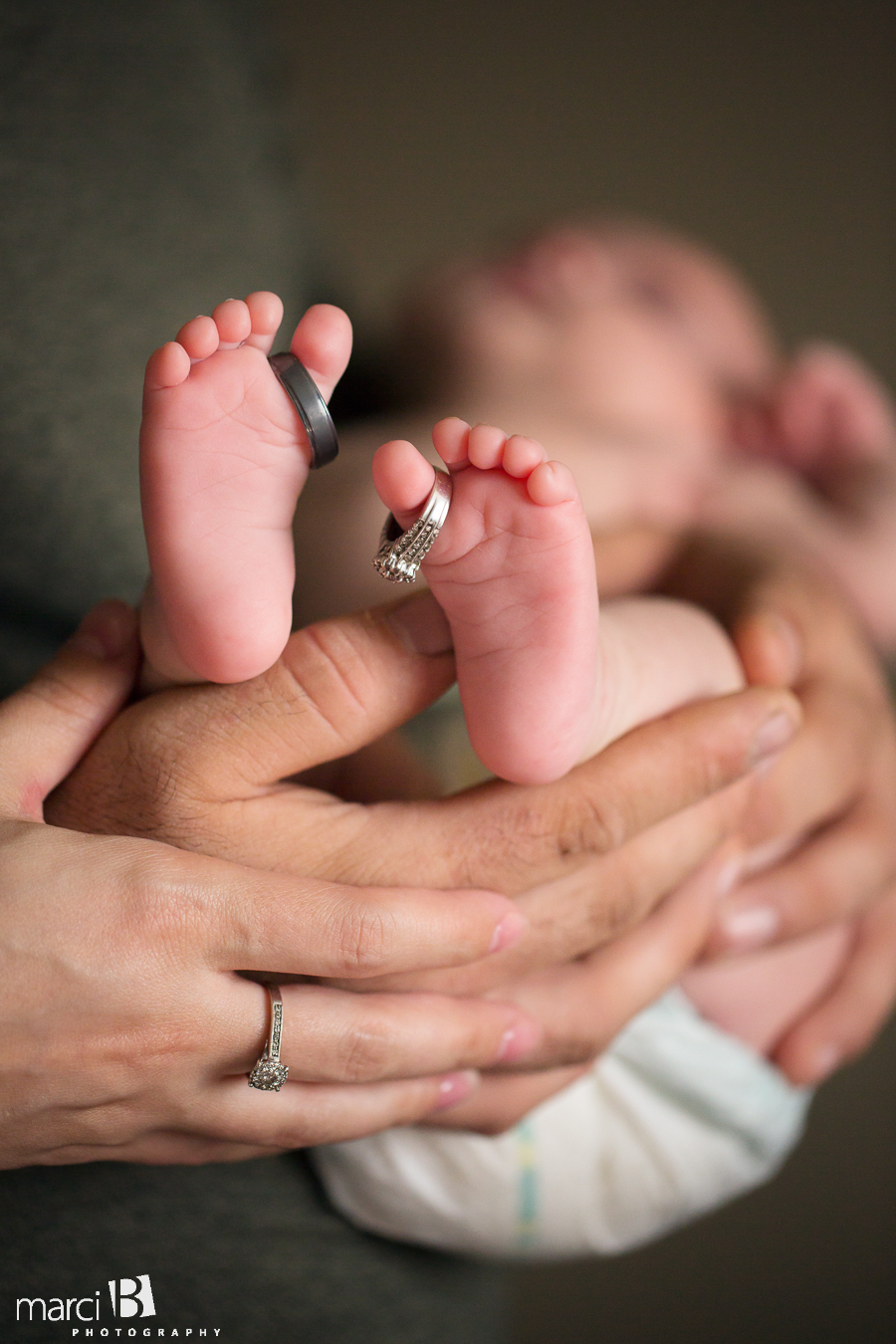 baby feet - wedding rings on toes of baby