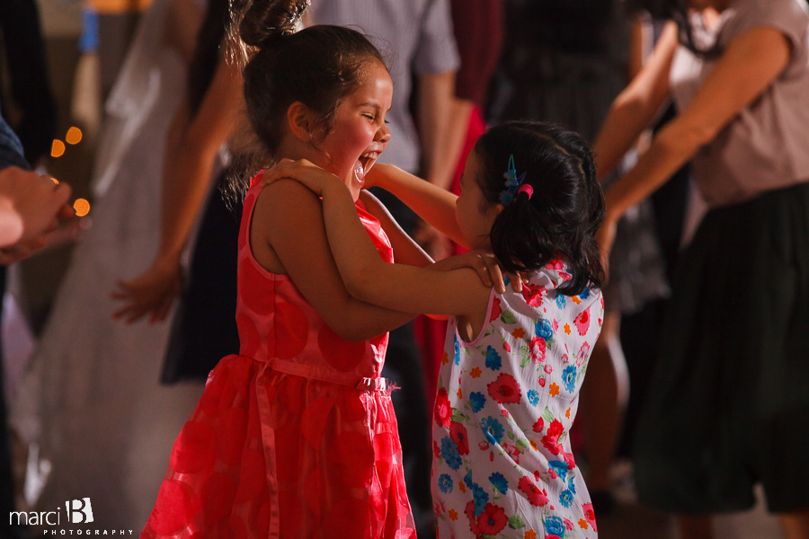 little girls dancing at reception