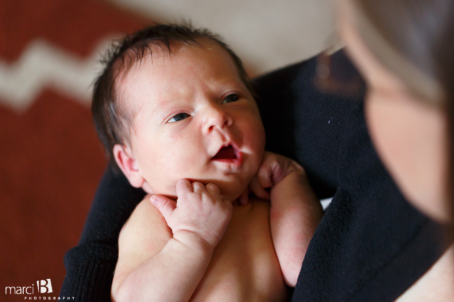 newborn looks at her mama - photographer