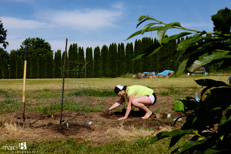 photo of woman planting garden