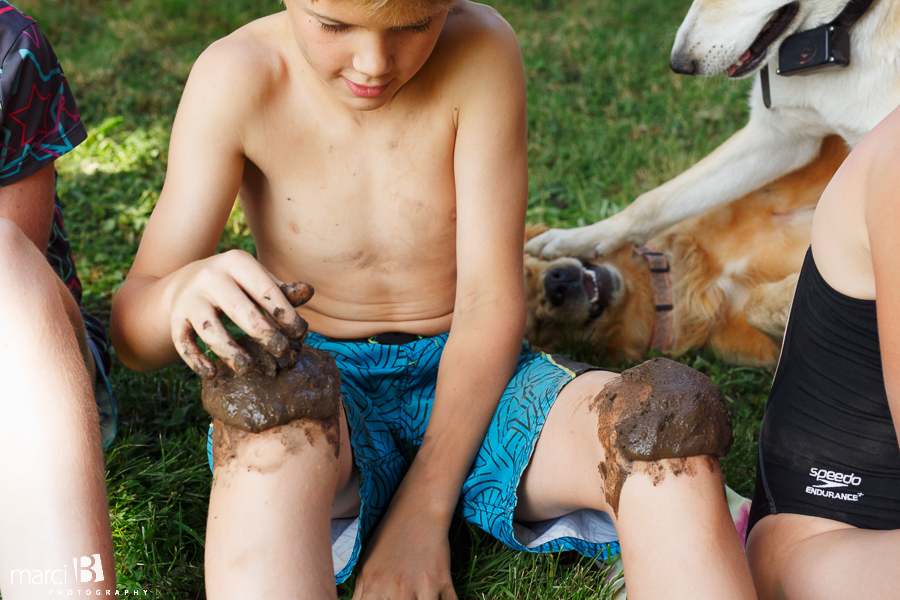 Children's lifestyle summer photos - playing in the yard - dogs playing - mud