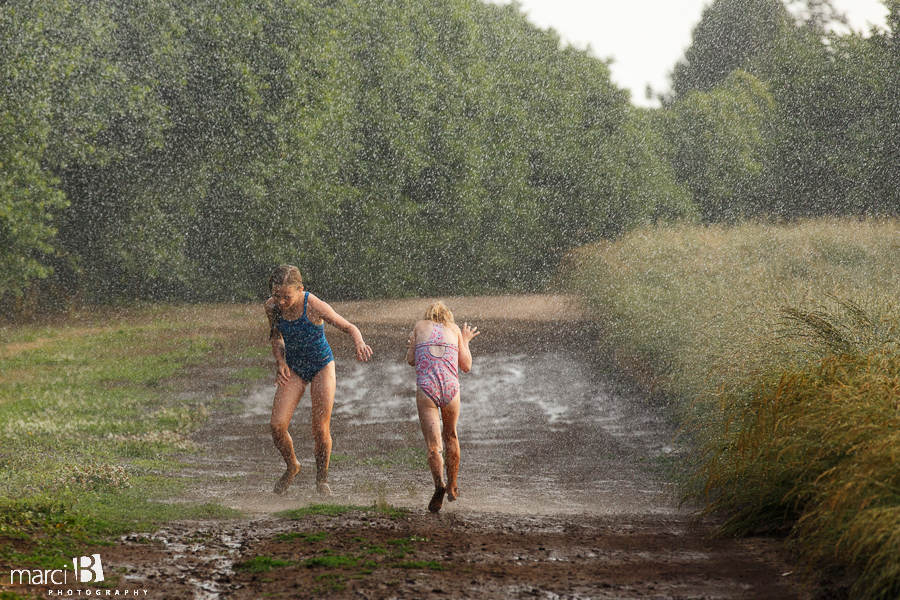 kids playing in sprinkler - summer photos - life on a farm