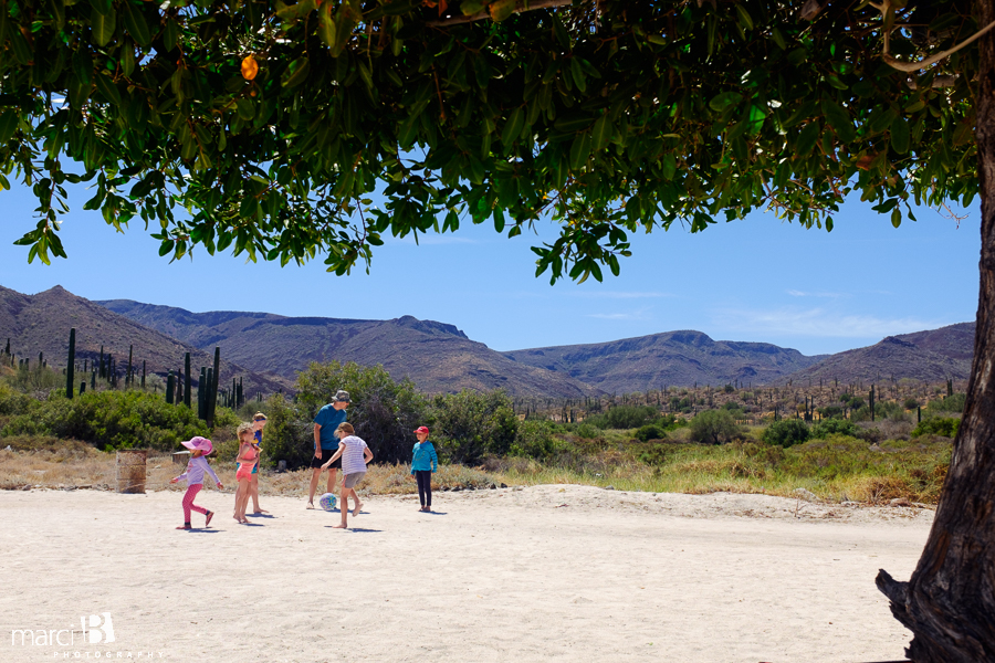 kids playing soccer in Mexico - soccer on dirt - family camping
