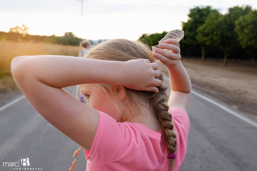 girl with feather in her hair - lifestyle photography