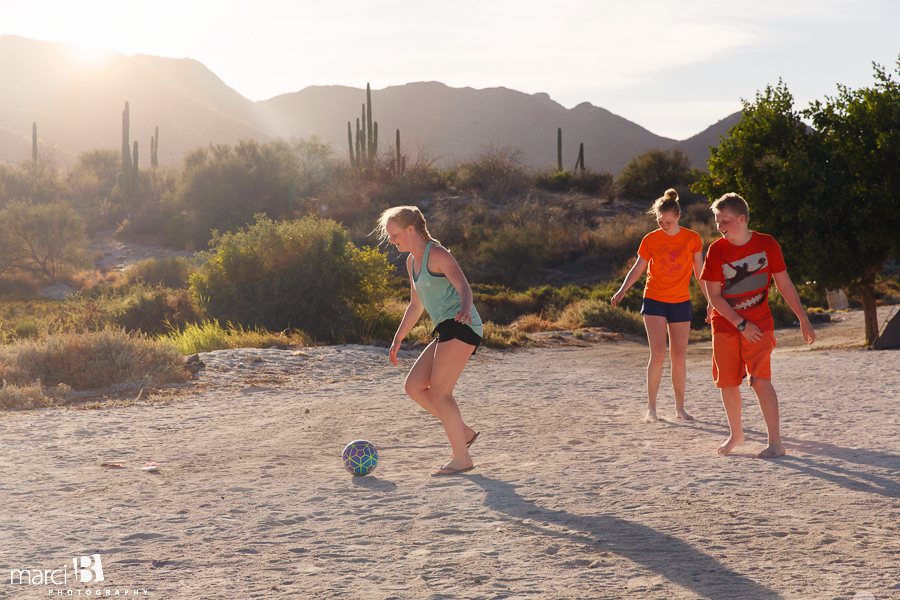 family soccer in the sunset - camping in Mexico - beach soccer