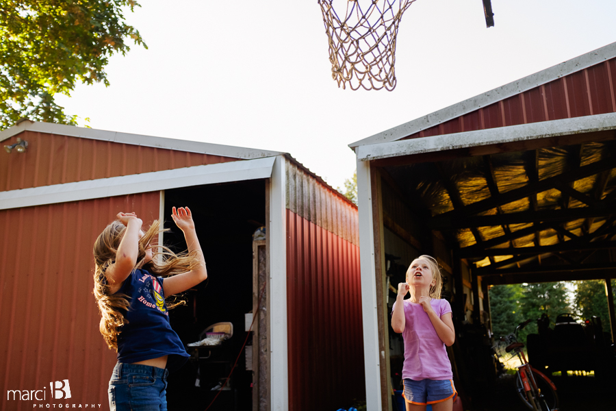 sisters - girls playing basketball - lifestyle photography - family life