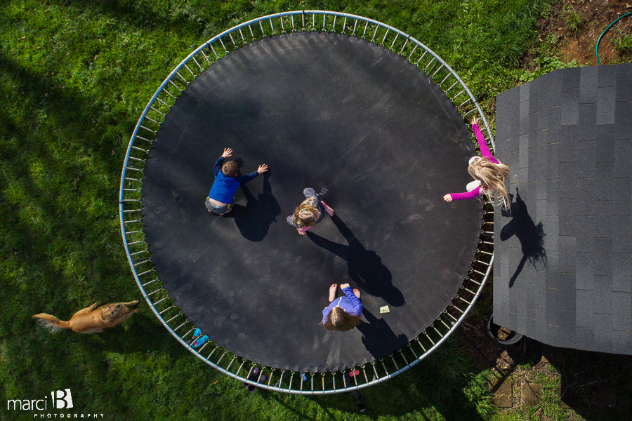 kids on trampoline - drone