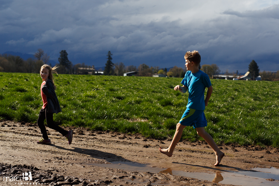 kids playing on farm - dramatic light - Pacific Northwest