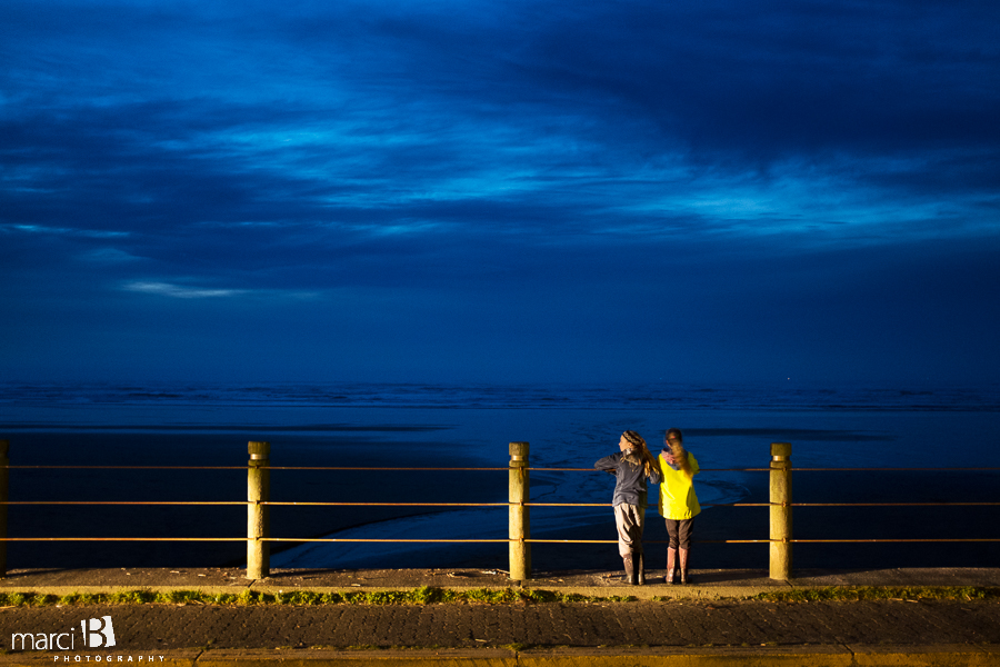Newport, OR - girls on beach - beach at night