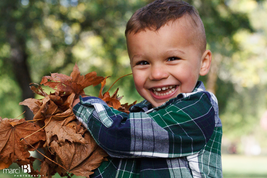 fall family photos - Corvallis photography - family photographer - photos of kids playing in leaves - boys in plaid - headshot