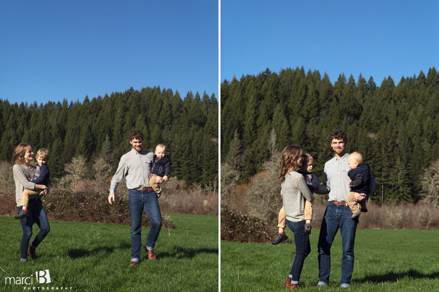 family photographer takes pictures of family with two young boys in Oregon Coast Range