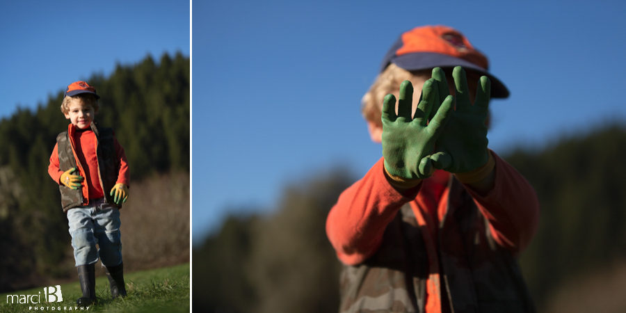 family photographer takes pictures of family with two young boys in Oregon Coast Range - Corvallis professional photographer - young boy in work gloves