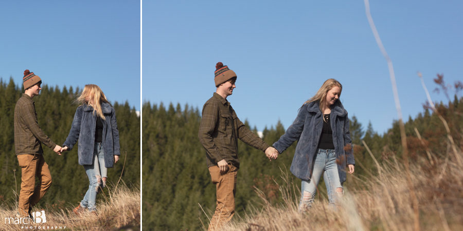 engaged couple walking in great outdoors