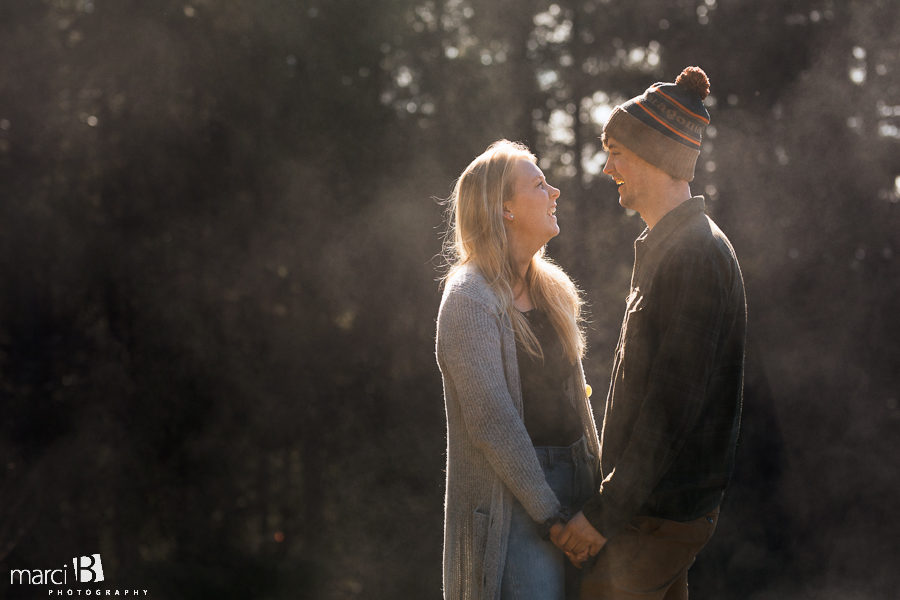 engagement photos with rim lighting and steam produced by the winter sun