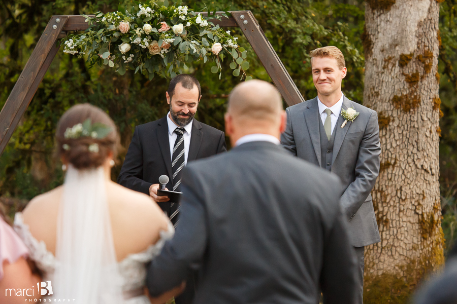 groom sees bride for first time walking down aisle