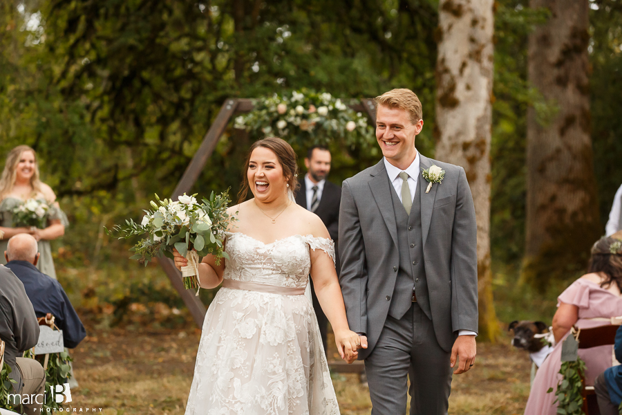 bride and groom exit wedding ceremony