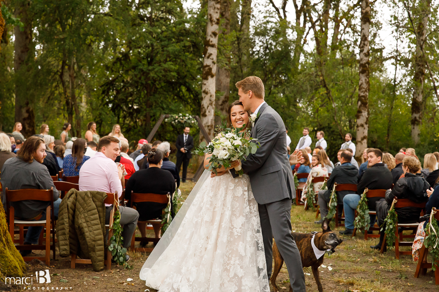 bride and groom kiss after ceremony