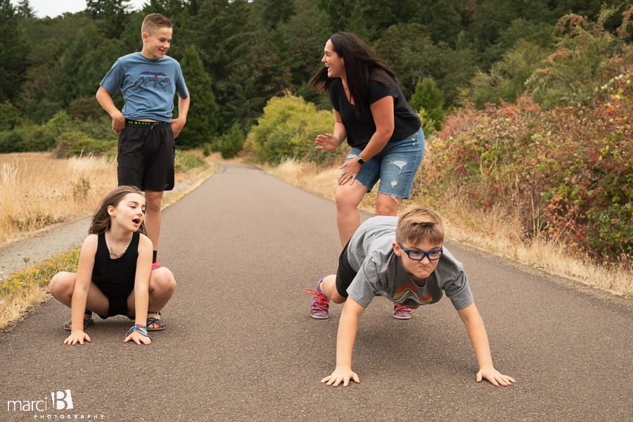 family plays together while on a walk